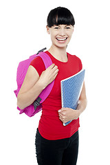 Image showing Charming young teenage girl ready to attend college