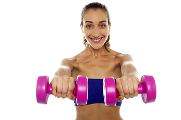 Image showing Lady lifting dumbbells, arms outstretched