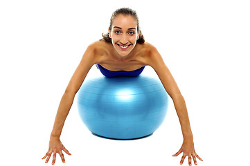 Image showing Young lady performing abdomen exercise