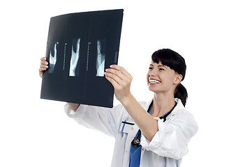 Image showing Cheerful female doctor reviewing patients x-ray report