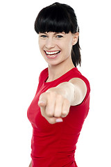 Image showing Attractive cheerful woman pointing at you