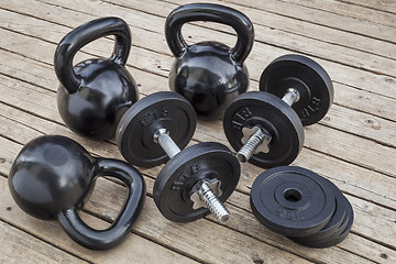 Image showing kettlebells and dumbbells