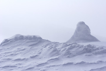 Image showing snow drift at top of mountain