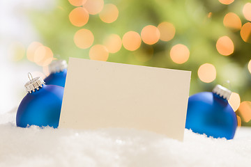 Image showing Blue Christmas Ornaments Behind Blank Off-white Card