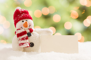 Image showing Cute Snowman with Blank White Card Over Abstract Background