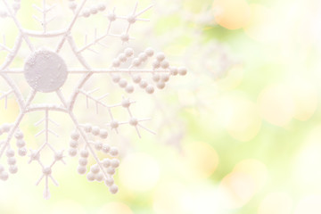 Image showing Snowflake Over an Abstract Green and Gold Background