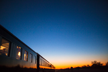 Image showing Train into sunset