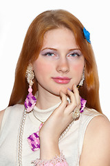 Image showing Redhead girl showing jewelry    