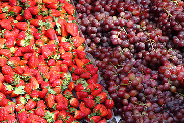 Image showing strawberries and red grapes background