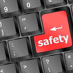 Image showing safety first concept with red key on computer keyboard