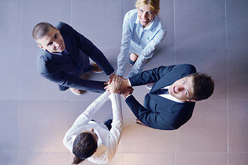 Image showing business people group joining hands