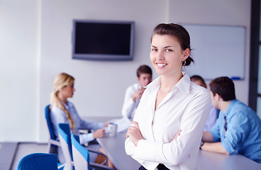 Image showing business woman with her staff in background at office