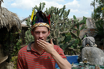 Image showing The man in the indian cap