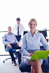 Image showing business woman with her staff in background at office