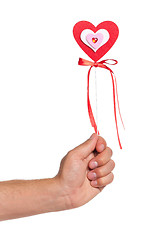 Image showing Hand with heart on a stick