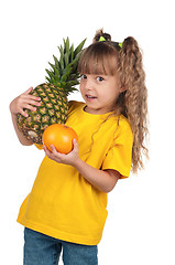 Image showing Little girl with pineapple