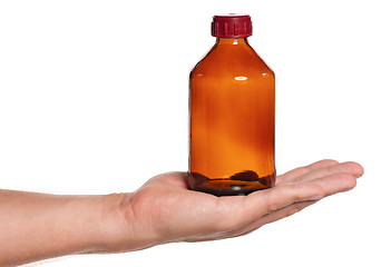 Image showing Hand with small bottle