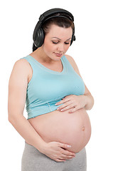 Image showing Pregnant belly with headphones