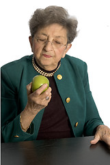 Image showing senior woman with apple