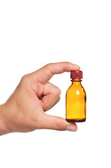 Image showing Hand with small bottle