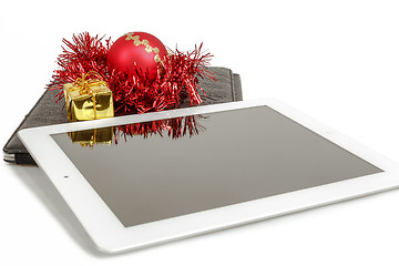 Image showing gift white tablet with Christmas ball, box and red chain