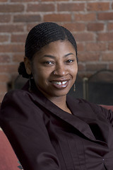 Image showing smiling woman on sofa