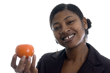 Image showing smiling woman with tangerine