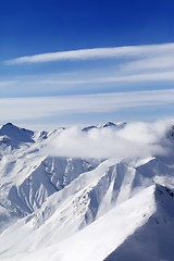 Image showing Snow mountains in clouds