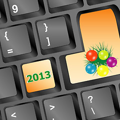Image showing christmas button with balls and fir on keyboard