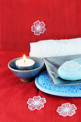 Image showing Burning candle with soap in a dish