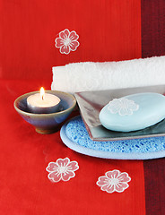 Image showing Burning candle with soap in a dish