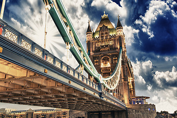 Image showing Famous Tower Bridge at sunset with clouds, seen from Tower of Lo