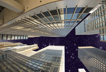 Image showing Street level view of Tall Skyscrapers in Manhattan night - New Y