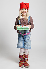 Image showing Smiling girl holding Christmas presents