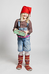 Image showing Smiling girl holding Christmas presents