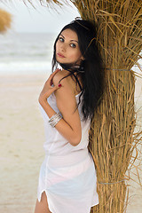 Image showing Pretty young brunette on a beach