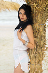 Image showing Young brunette on a beach