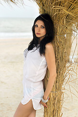 Image showing Attractive young brunette on a beach