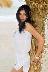 Image showing Beautiful young brunette on a beach