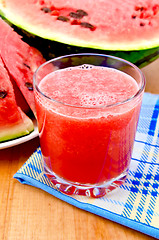 Image showing Juice watermelon on a napkin and a board