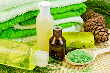 Image showing Oil and toiletries with cedar cones