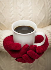 Image showing Woman in Sweater with Red Mittens Holding Cup of Coffee