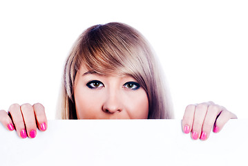 Image showing woman  hiding behind billboard