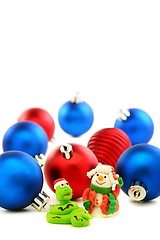 Image showing Snake in the Santa hat and cheerful snowman.