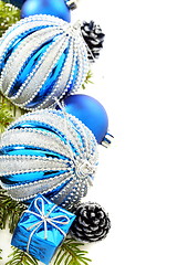 Image showing Christmas card with blue balls and cones.