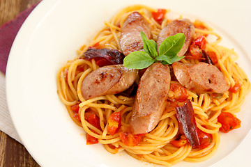 Image showing Spaghetti with sausage and tomato