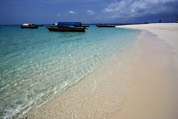 Image showing beach and boats in sand bank  zanzibar