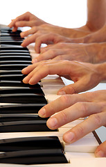 Image showing Six hands on grand piano