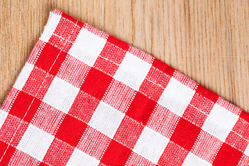 Image showing checkered tablecloth on wooden table