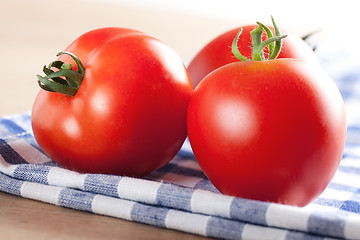 Image showing red tomatoes on table